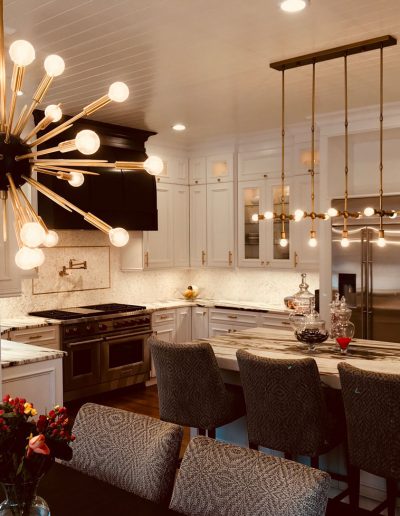 A kitchen with a dining table and chairs