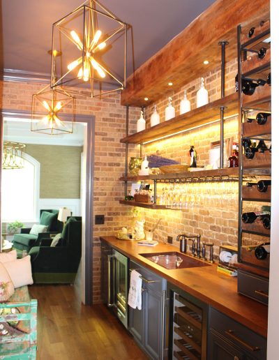 A bar with shelves and lights above it