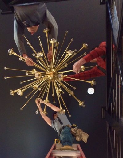 A group of people hanging from the ceiling.